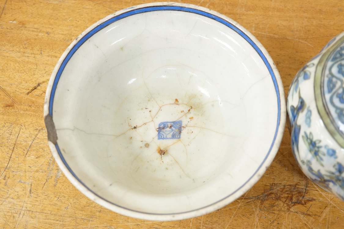 A Persian bird painted fritware lobed vase, 19.5cm high and a similar bowl, Qajar dynasty (2)